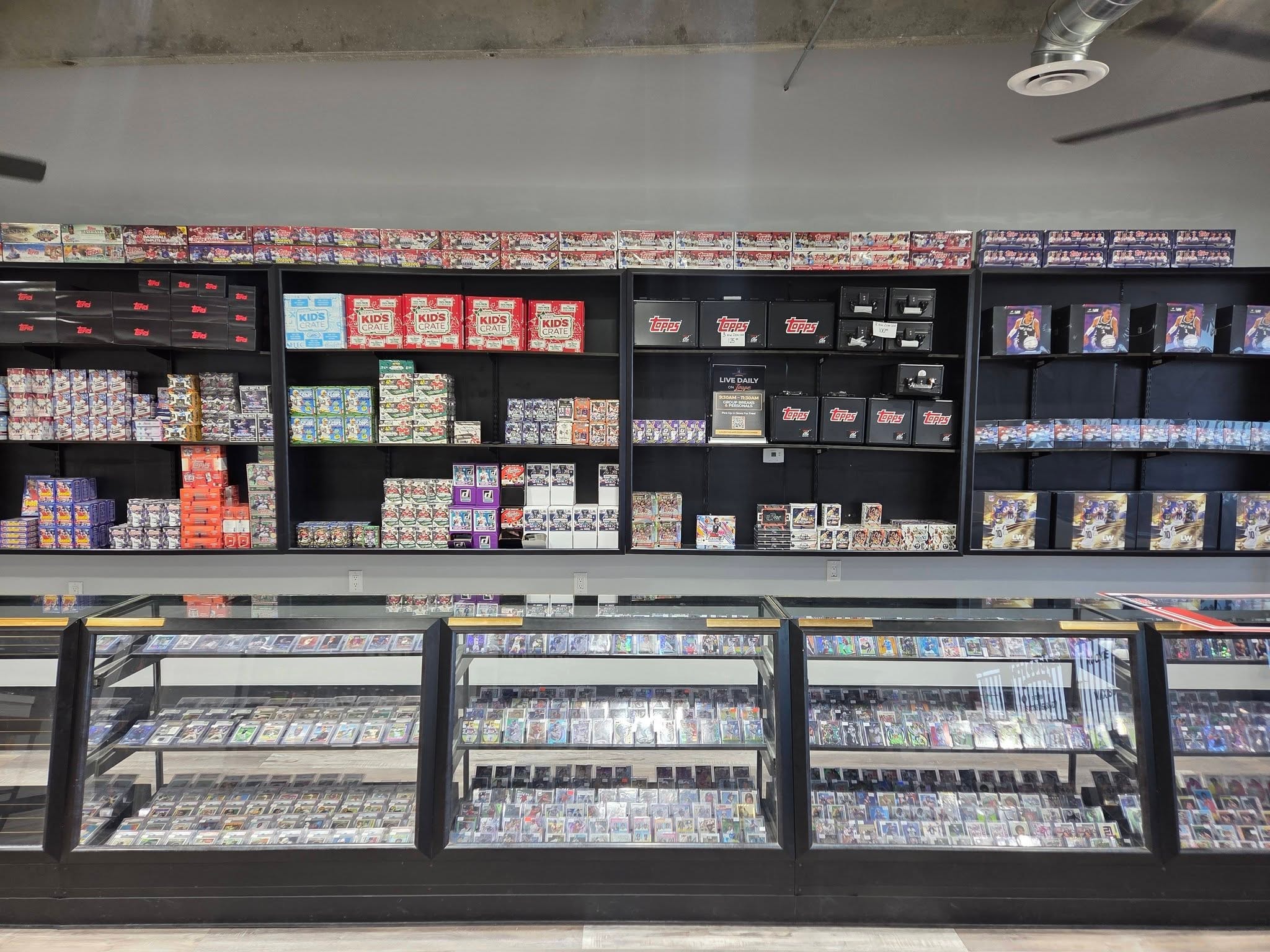 Sports card shop display cases and retail inventory